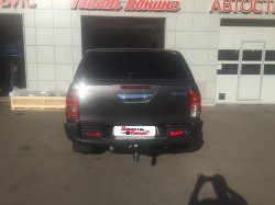 Бампер задний усиленный с квадратом под фаркоп (композит) Toyota Hilux 2015, 2016, 2017, 2018, 2019, 2020, 2021, 2022, 2023 годов